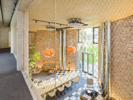 Stainless steel cable mesh for safety and fall protection by Carl Stahl DecorCable at Flower Hotel Essen.